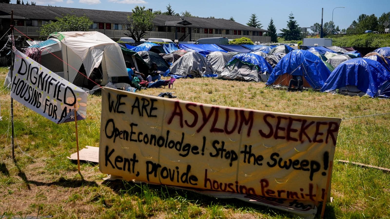 Hundreds of asylum-seekers are camped out near Seattle. There’s a vacant motel next door