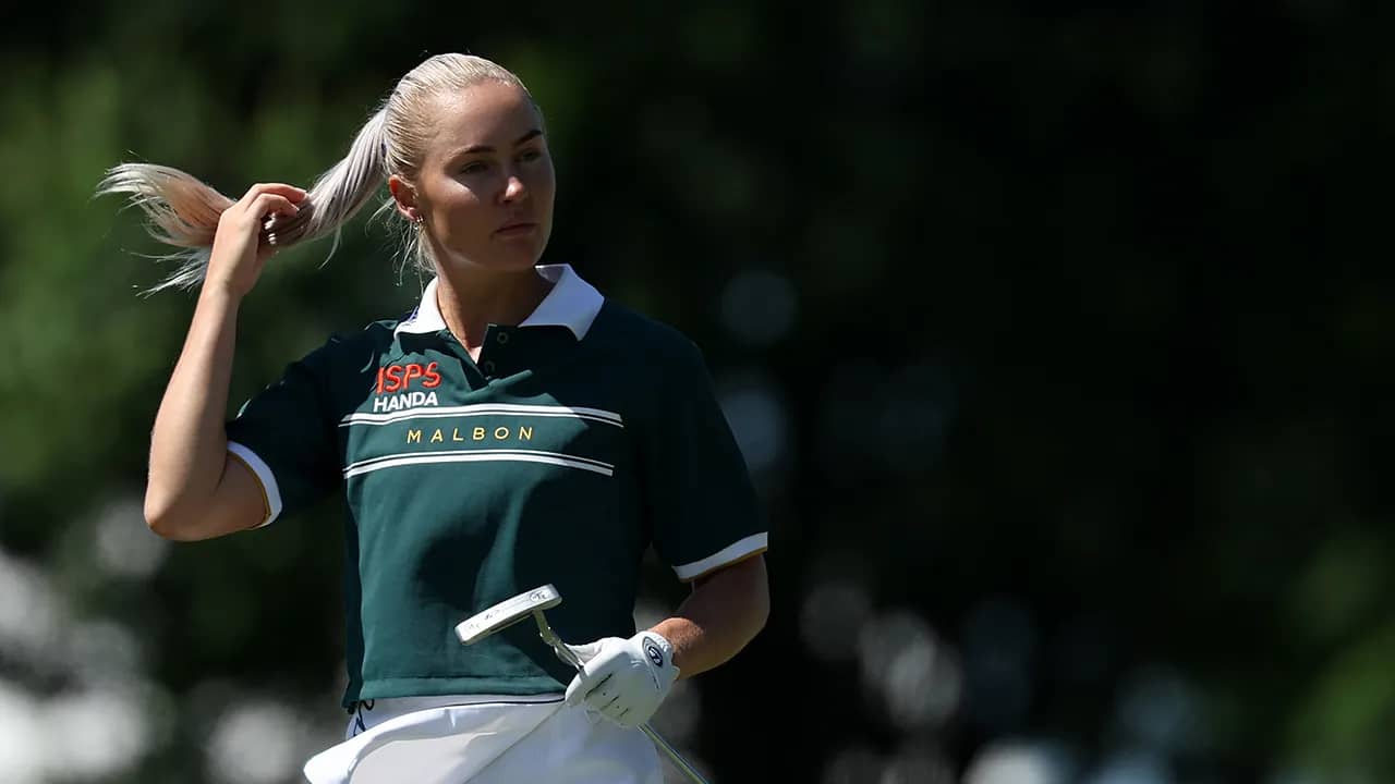 LPGA Tour star Charley Hull does her best John Daly impression while signing autographs for fans